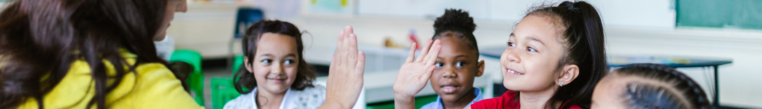 Educators header showing a classroom with smiling students raising their hands