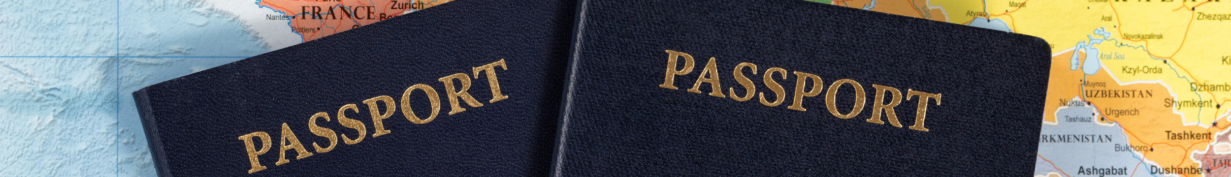 Passports header showing two passports placed on a map