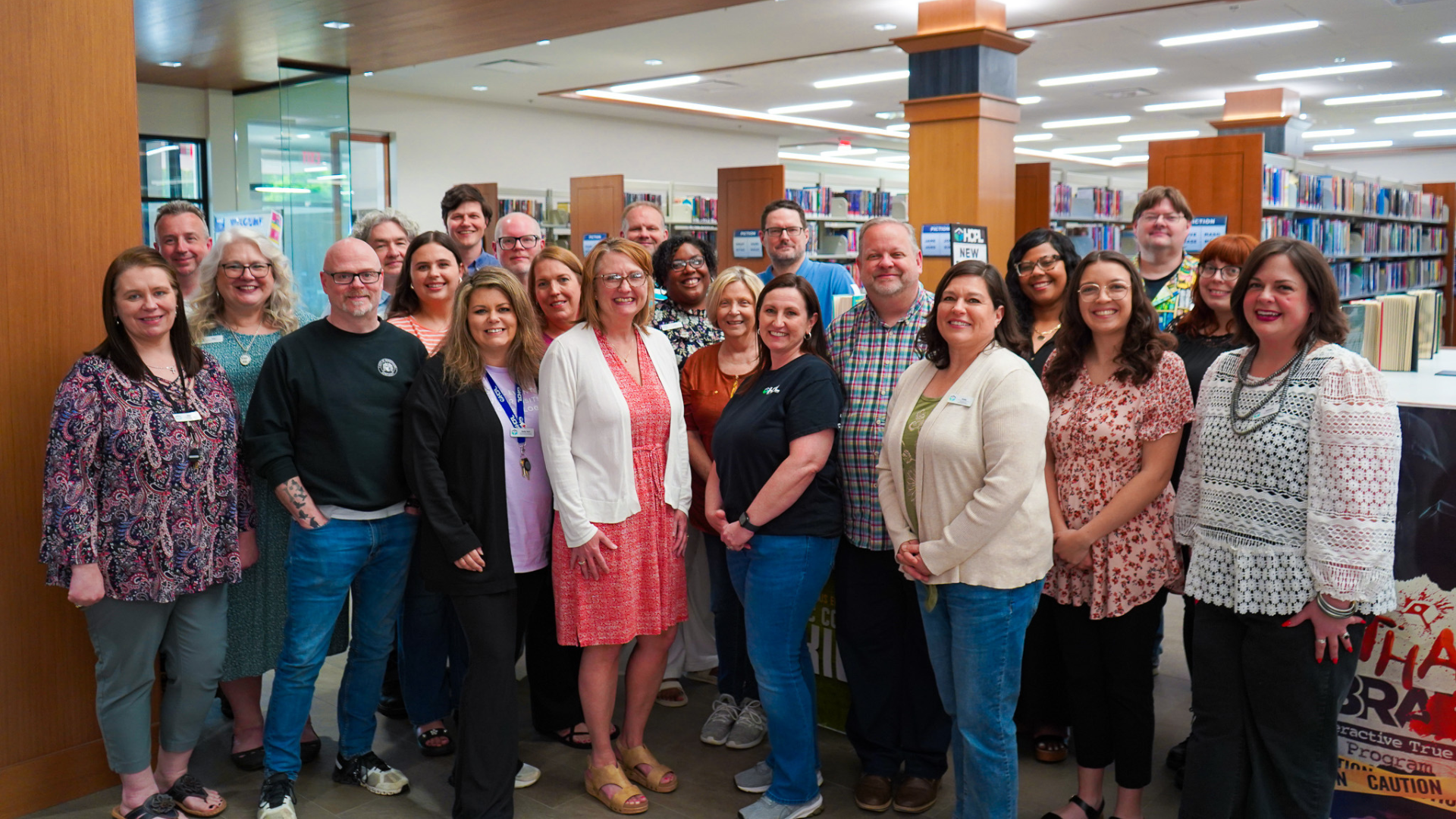 Group photo of the library staff smiling