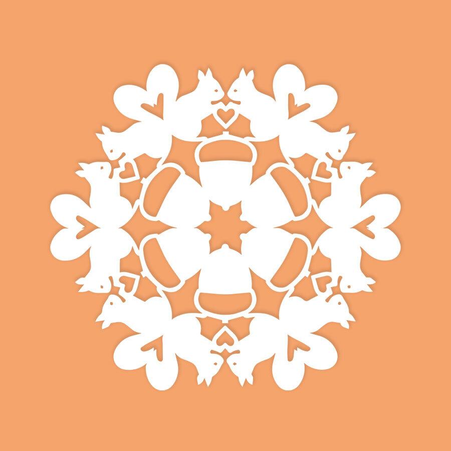 paper snowflake with squirrel pattern