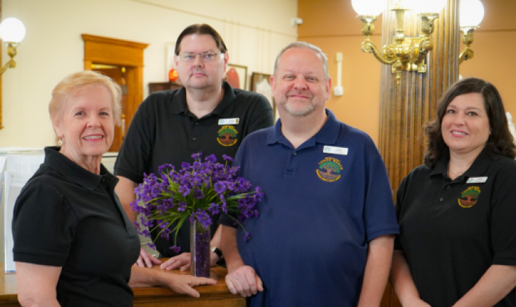 Four genealogy and local history librarians smiling